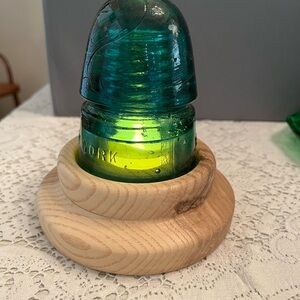 B&W “Redneck” Fairy Lamp. Vintage teal insulator atop a handmade White Oak Base.